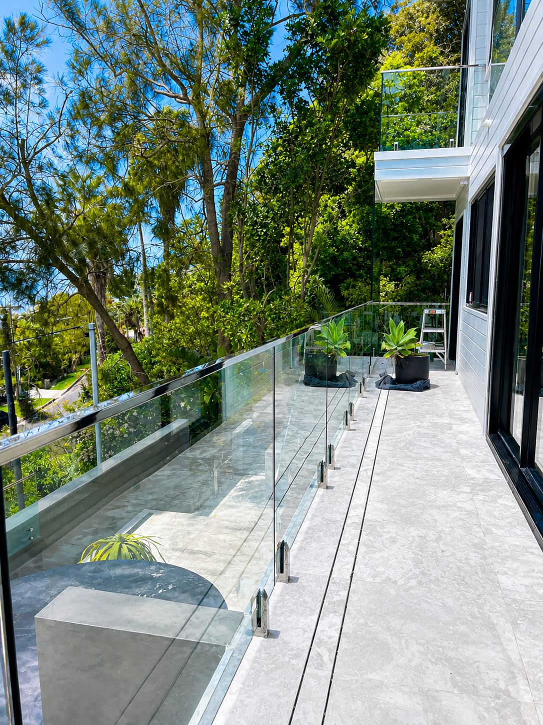 Polished steel handrail over frameless glass - Whale Beach house - frameless glass, ocean views
