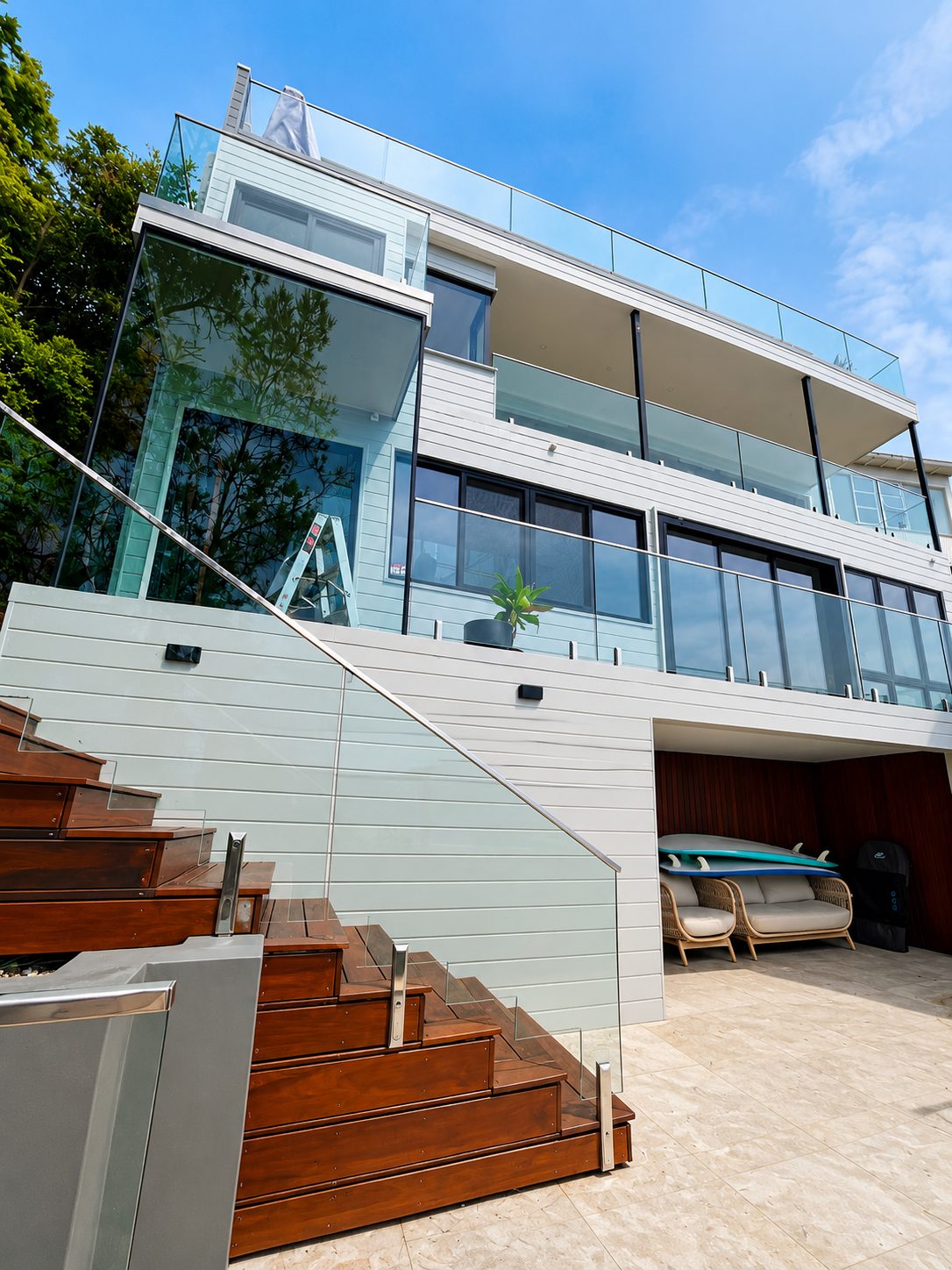 Glass and steel handrails through the stairwell - Whale Beach house - frameless glass, ocean views