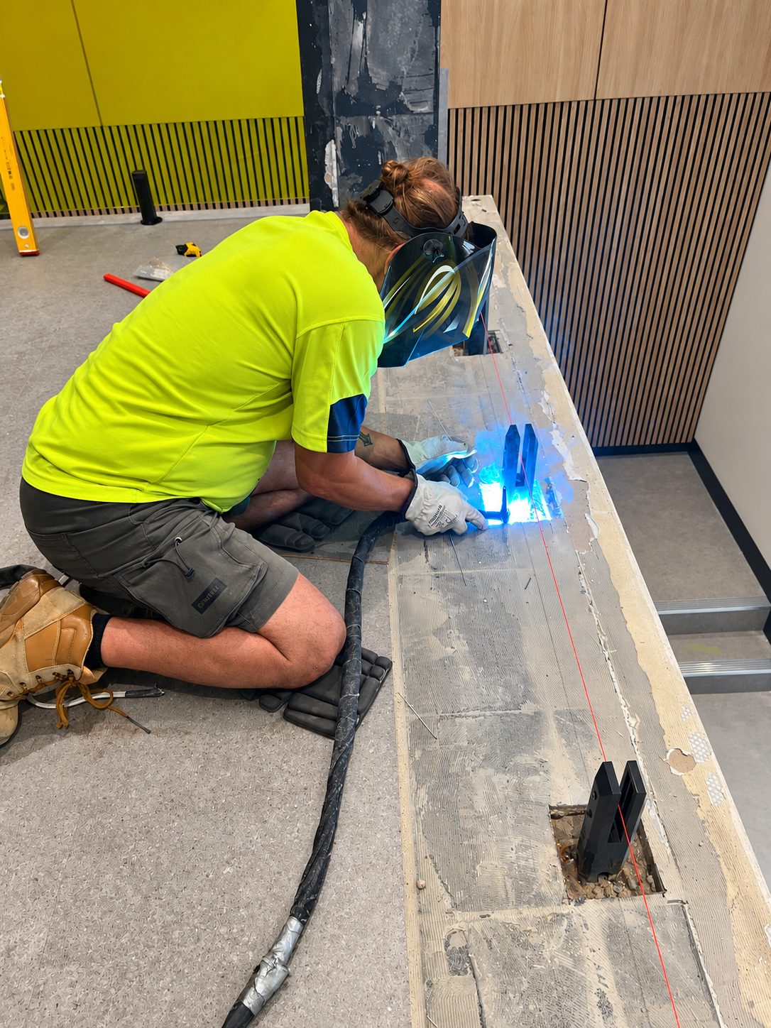 Posts welded on site, set to a line - Tinted glass balustrade - McDonald's Headquarters, Thornleigh