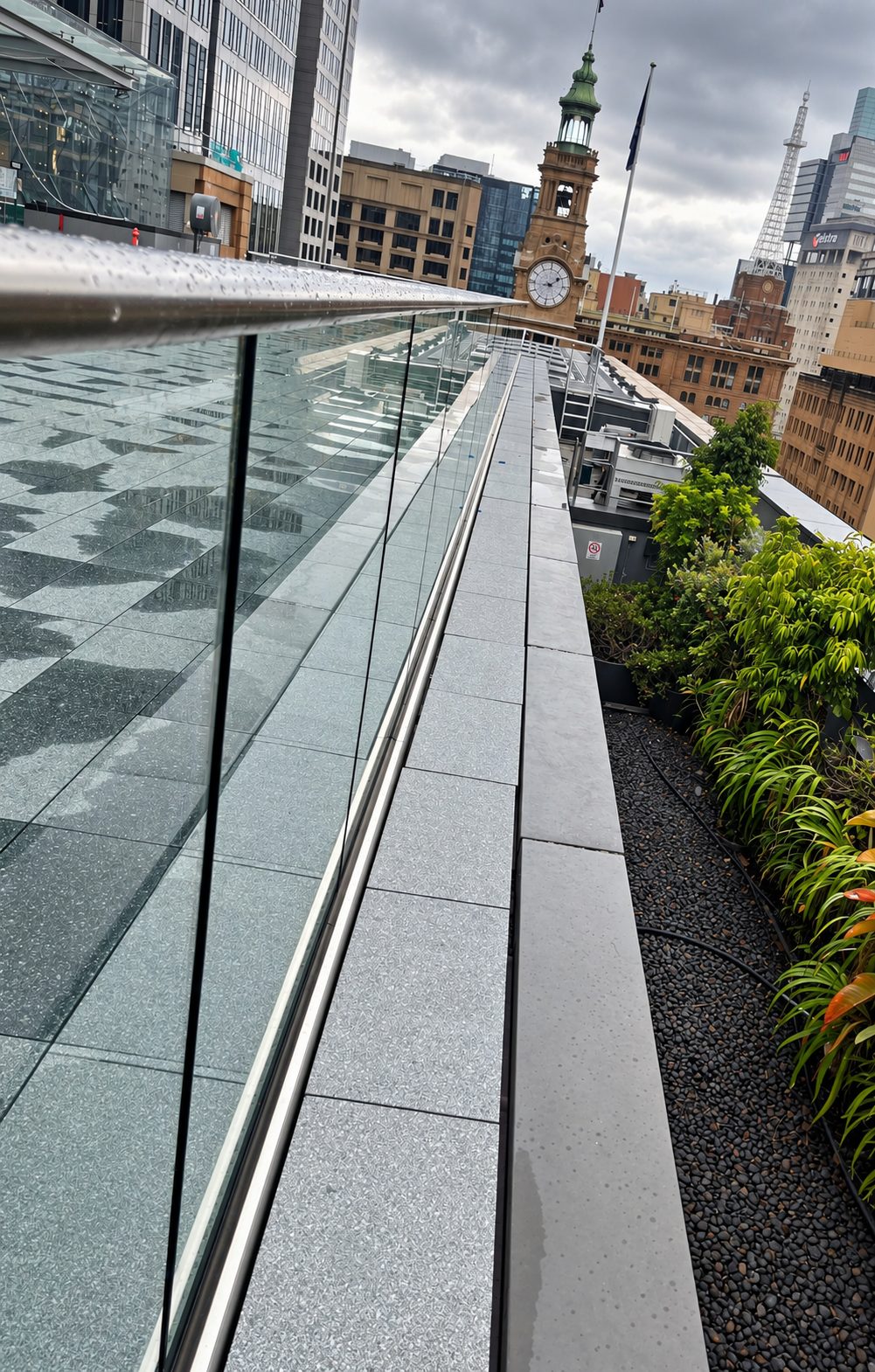 Curved handrail detail beside the rooftop garden - Rooftop glass balustrade, Sydney CBD
