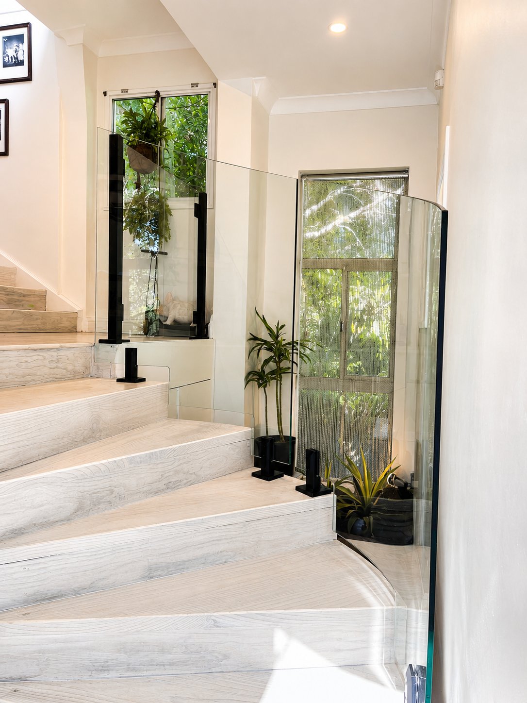 Curved stepped glass with lift access doors - East Ryde - Glass Stair Balustrades, Fusion Glass