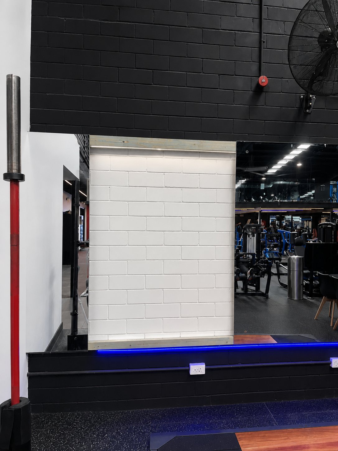 Damaged panel removed and the wall cleared, ready for the new mirror - Gym mirror replacement - Marrickville
