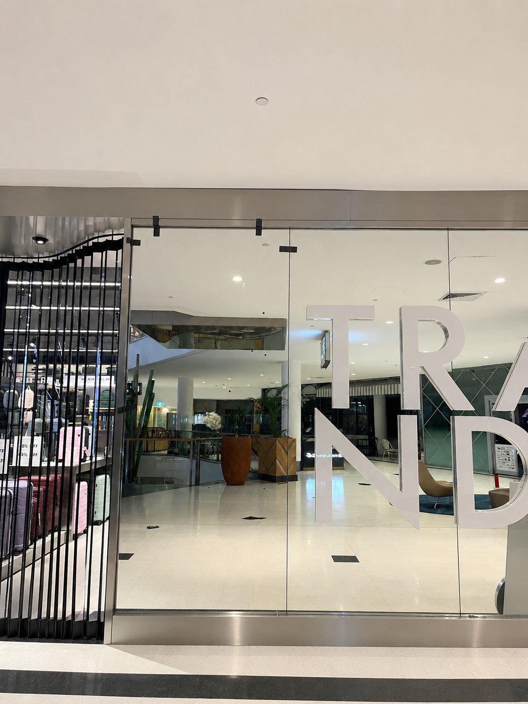 Close-up of the replacement mirror fitted into the existing stainless frame - Retail mirror replacement - Macarthur Square Shopping Centre