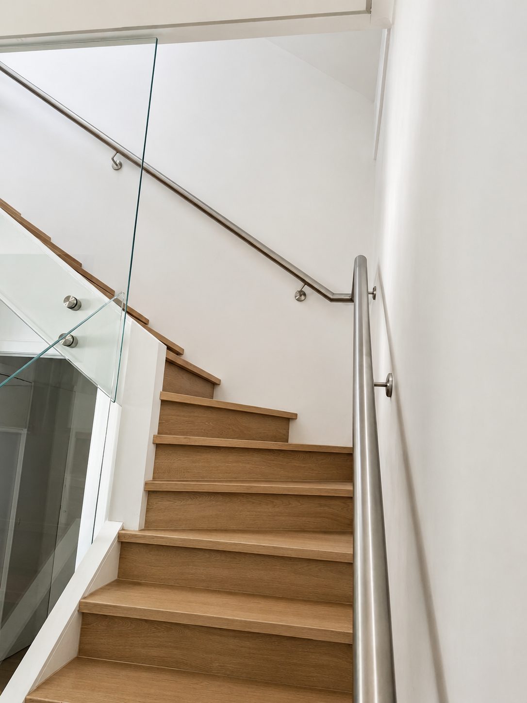 Steel and glass, installed as one system - Curved handrail on a Sydney staircase